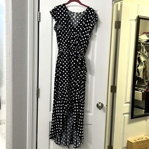 Grecerelle wrap look dress. Asymmetrical hem dark navy with white polka dots.